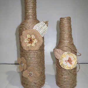 2 Jute wrapped wine bottles/vases. Burlap flowers.